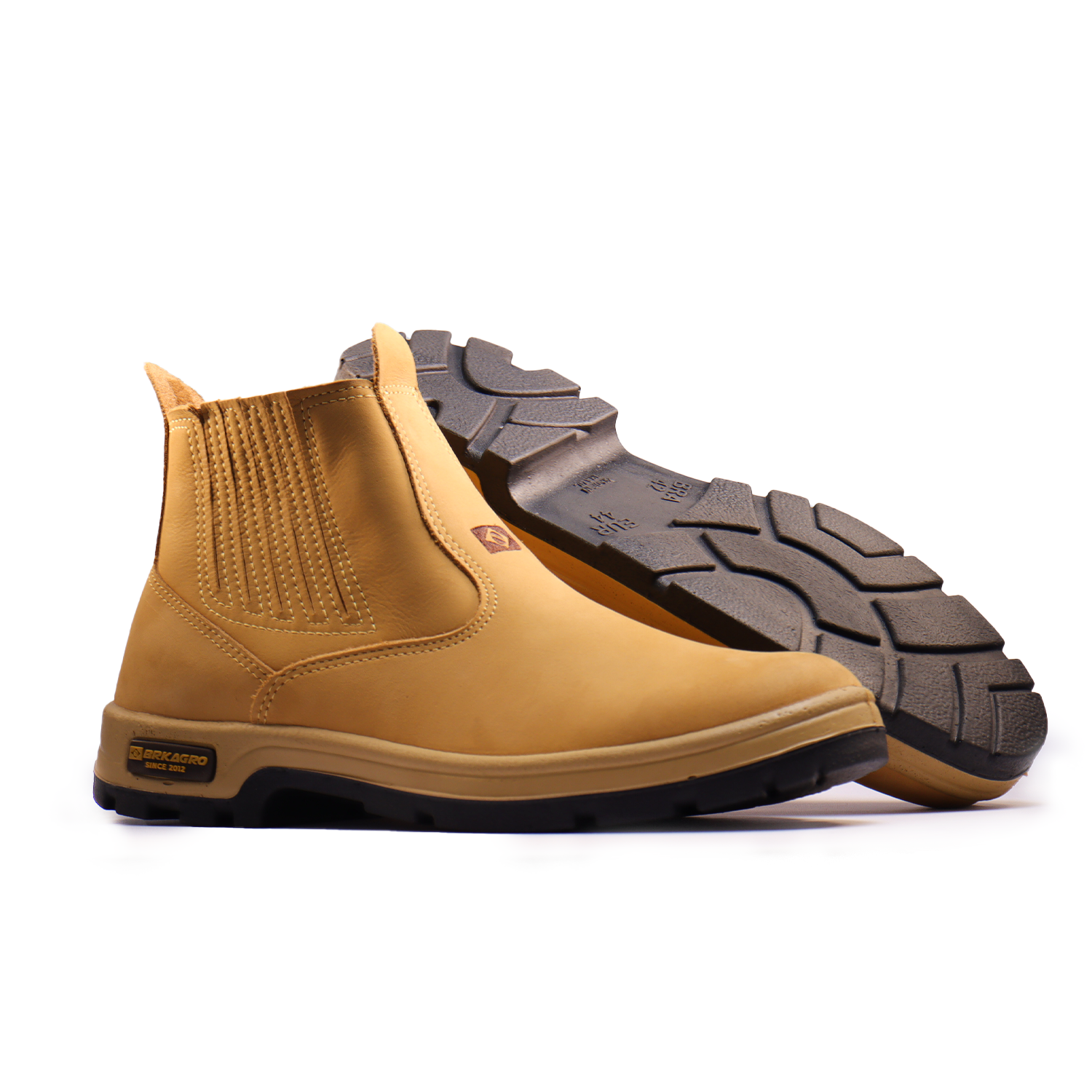 Botas de couro bege estilo Chelsea com sola de borracha resistente e detalhes elásticos laterais